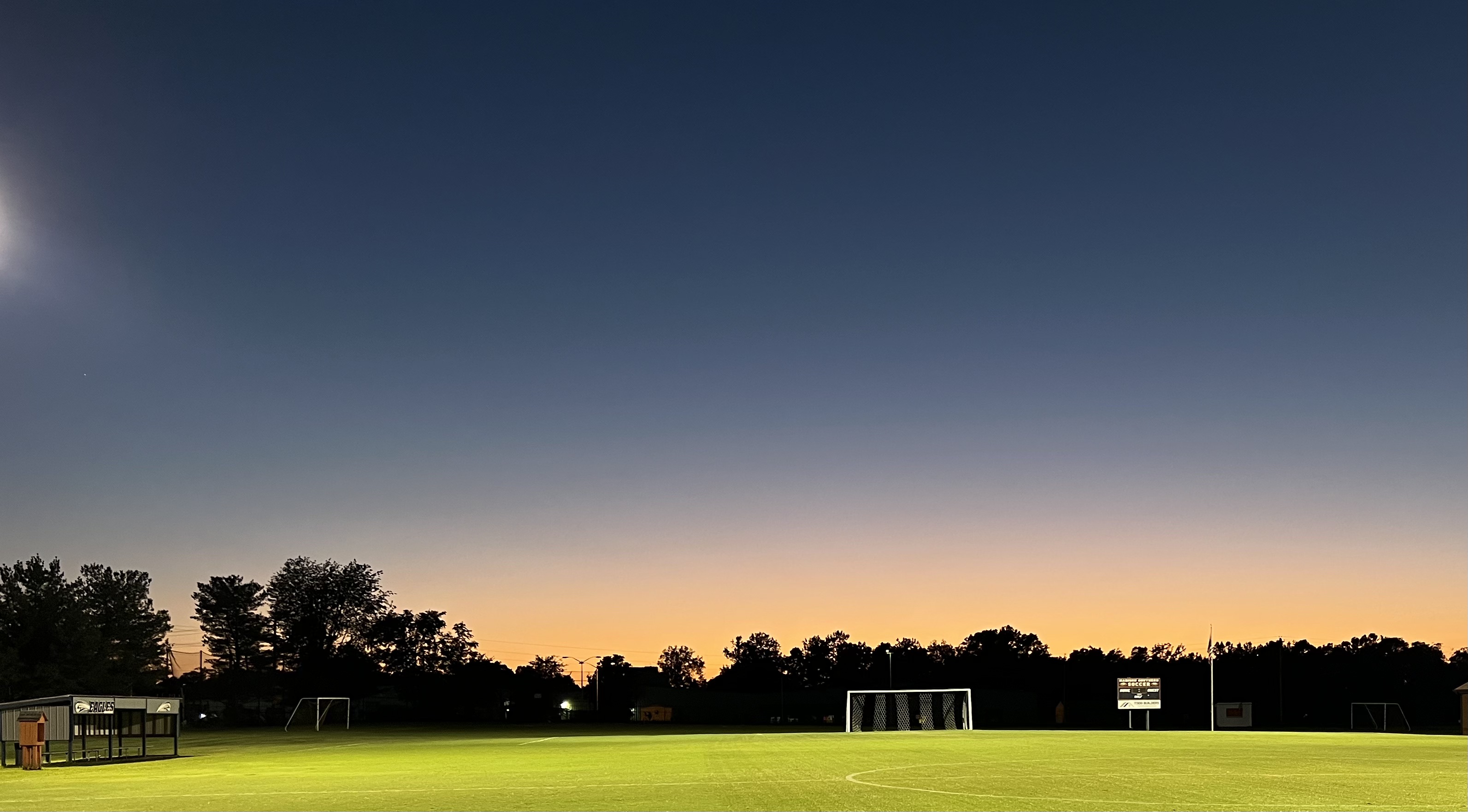 Empty soccer field at dusk